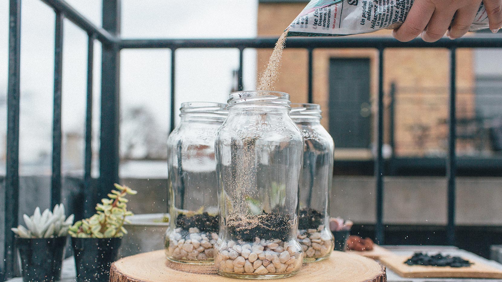 Lay down a layer of soil and a layer of sand
