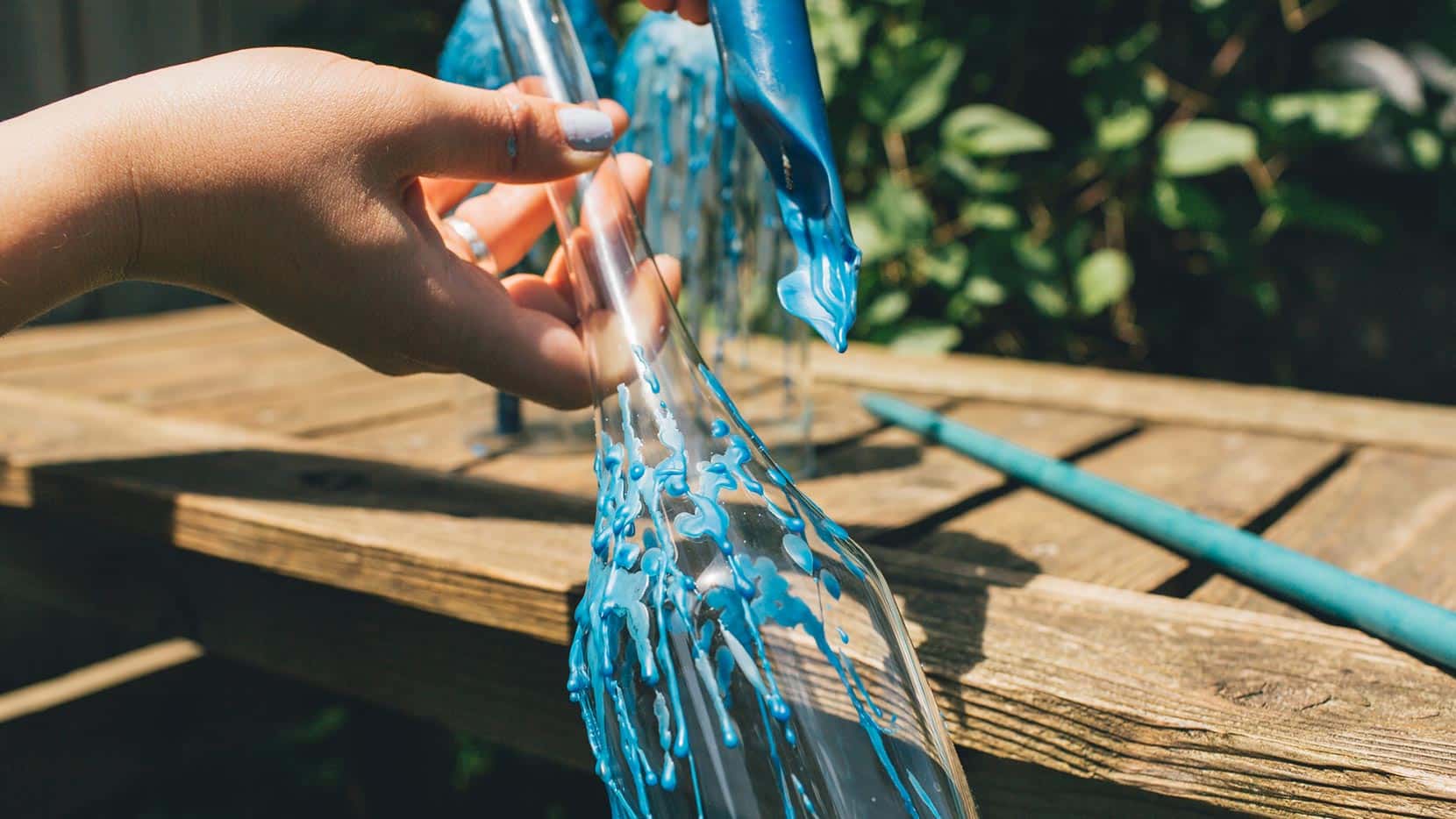 Allow wax to accumulate around neck and body of the bottle; continue as desired<br />
<br />
Blow taper candle out and place into wine bottle