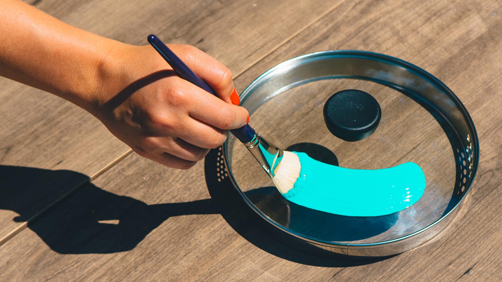 Paint pot lids (around their handles) with a variety of colors and allow to dry thoroughly