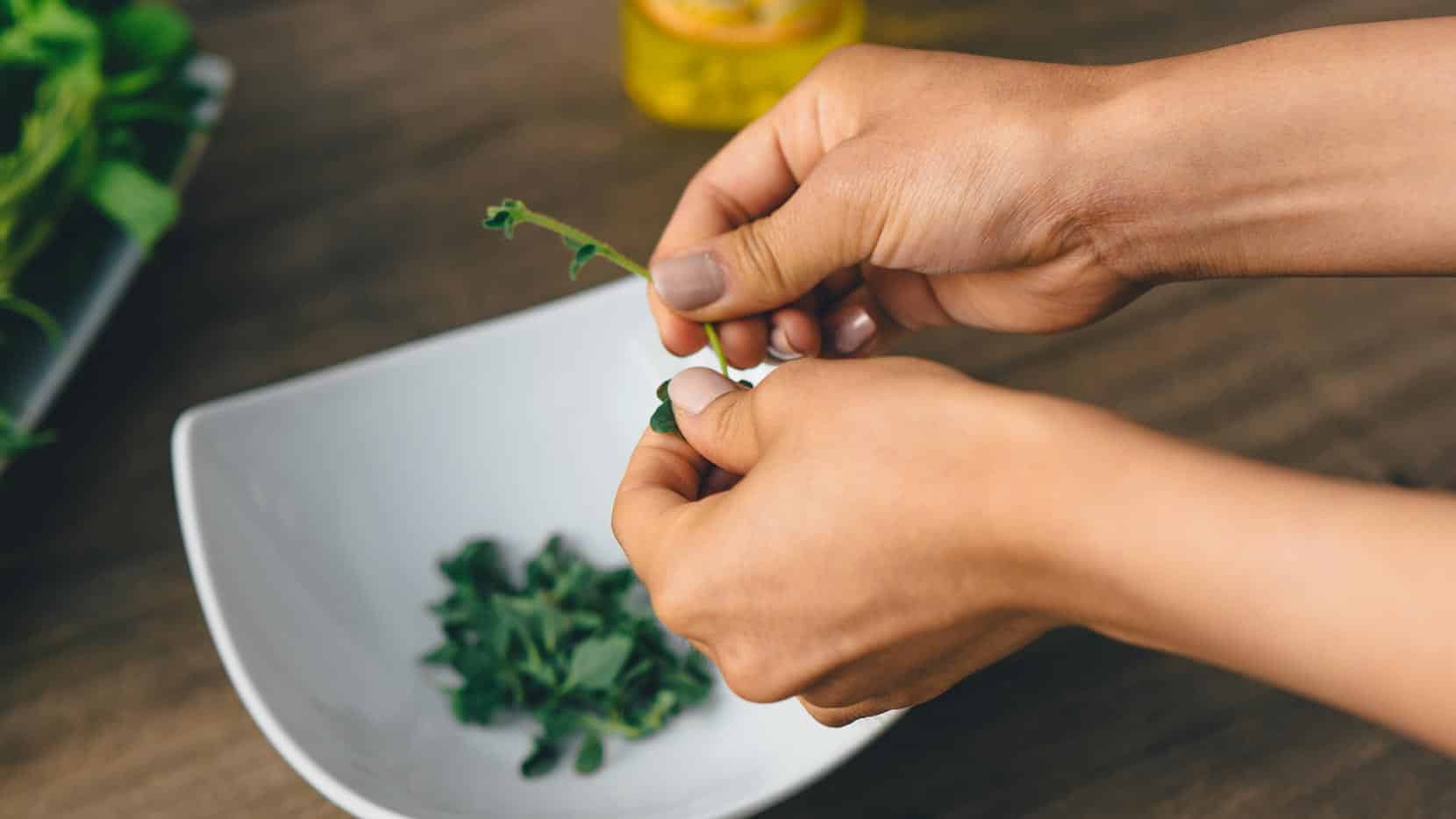 Break up herbs by hand