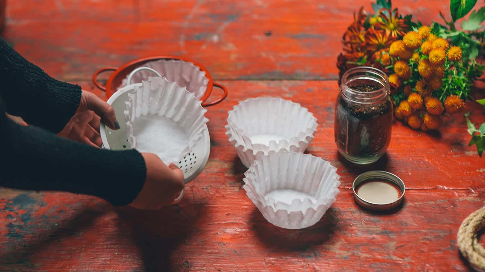 Place coffee filter in colander to cover holes