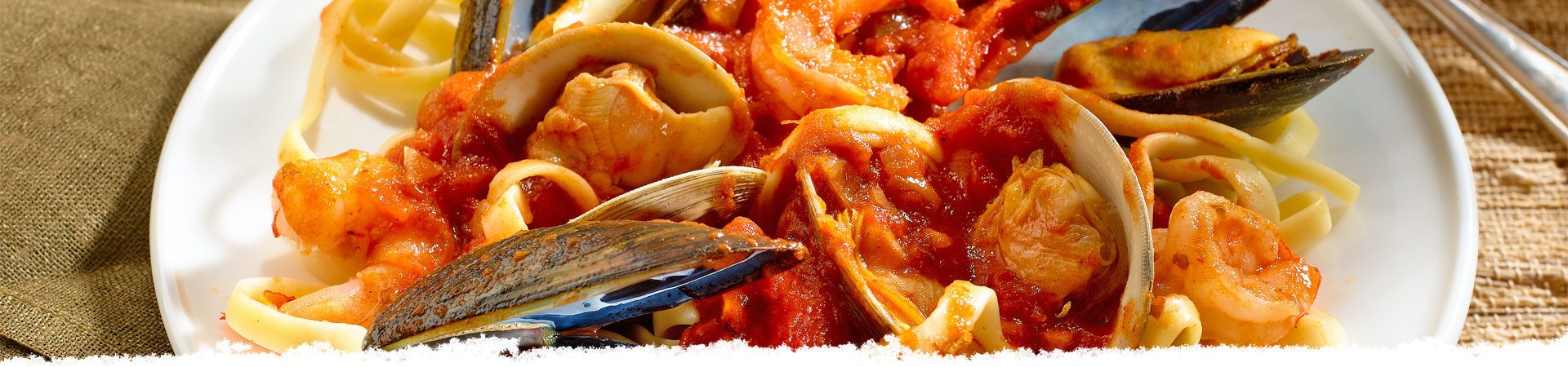 Sicilian Fish Stew Over Fettuccine