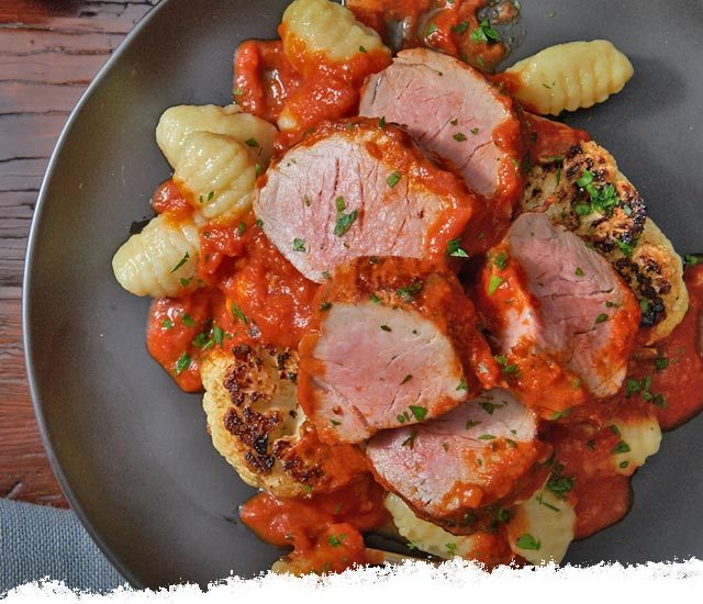 Cauliflower “Steaks” with Porcini & Truffled Pork & Gnocchi
